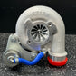 Turbocharger on a black and white speckled surface